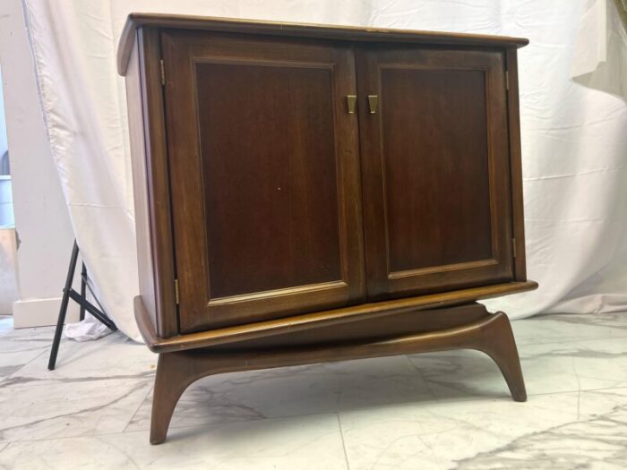 1960s mid century modern swivel cabinet on sculpted legs 6251