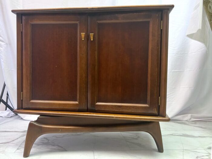 1960s mid century modern swivel cabinet on sculpted legs 6644