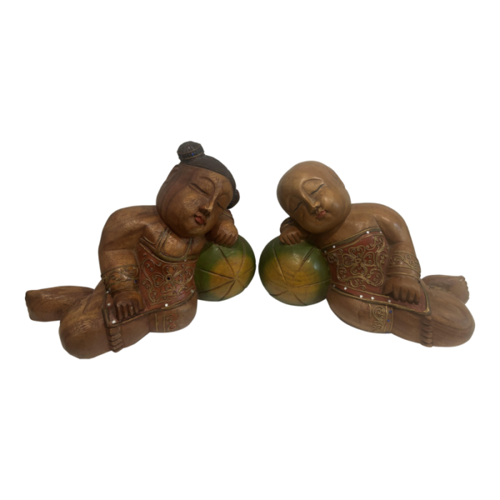 1980s carved and painted asian wood carvings of sleeping children on melons set of 2 3792