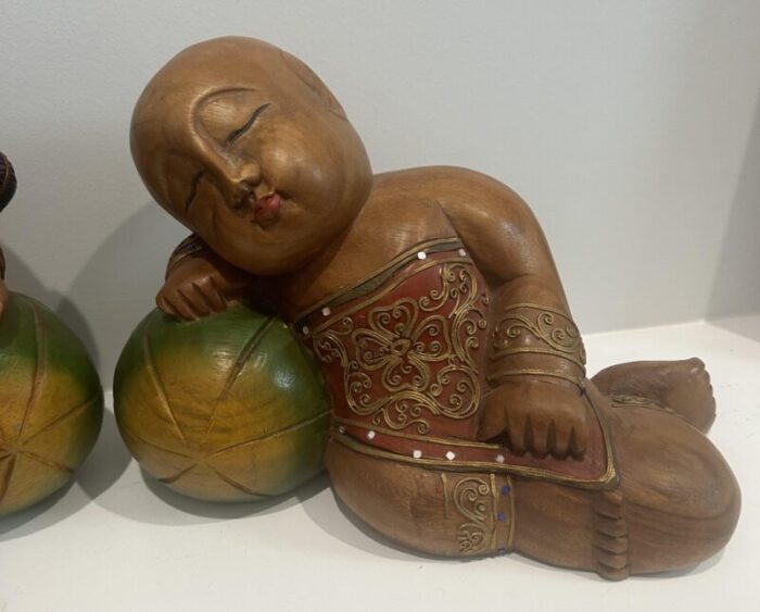 1980s carved and painted asian wood carvings of sleeping children on melons set of 2 6673