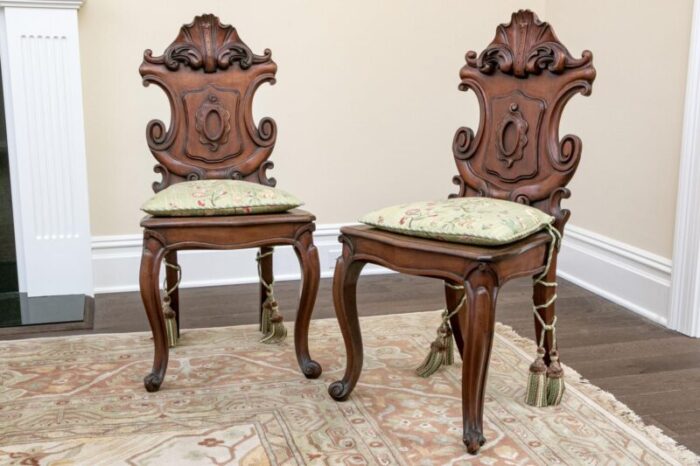 19th century continental cartouche form carved walnut valet hall chairsa pair 0646