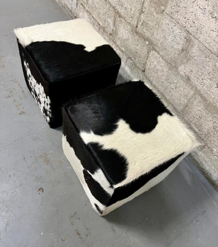 a pair of late 20th century cow hide ottomans footstools 6835