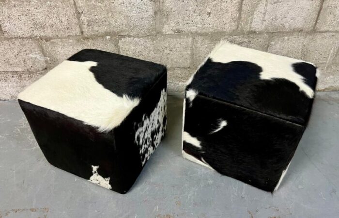 a pair of late 20th century cow hide ottomans footstools 8640