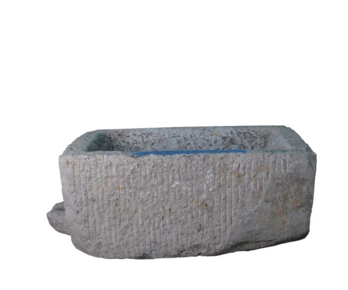 antique long hand chiseled stone trough 1535