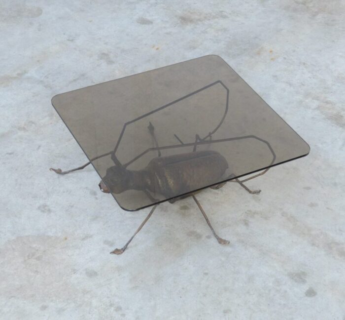 coffee table with a handcrafted metal cricket sculpture base 1970s 15