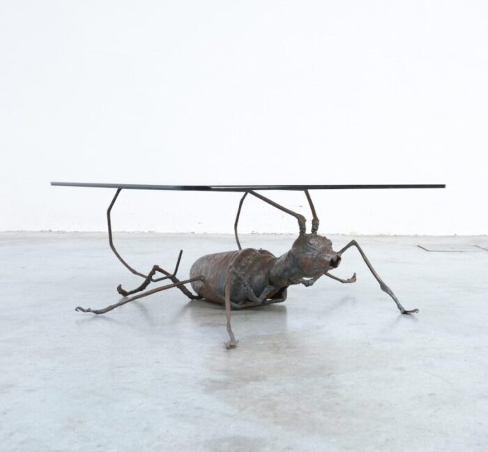 coffee table with a handcrafted metal cricket sculpture base 1970s 16