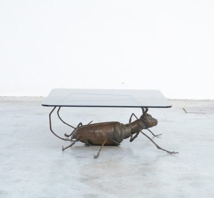 coffee table with a handcrafted metal cricket sculpture base 1970s 2