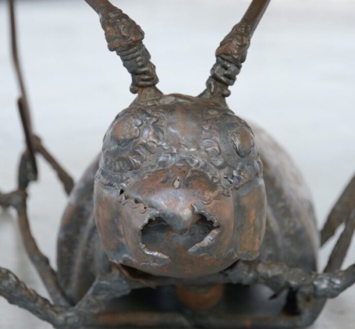 coffee table with a handcrafted metal cricket sculpture base 1970s 5