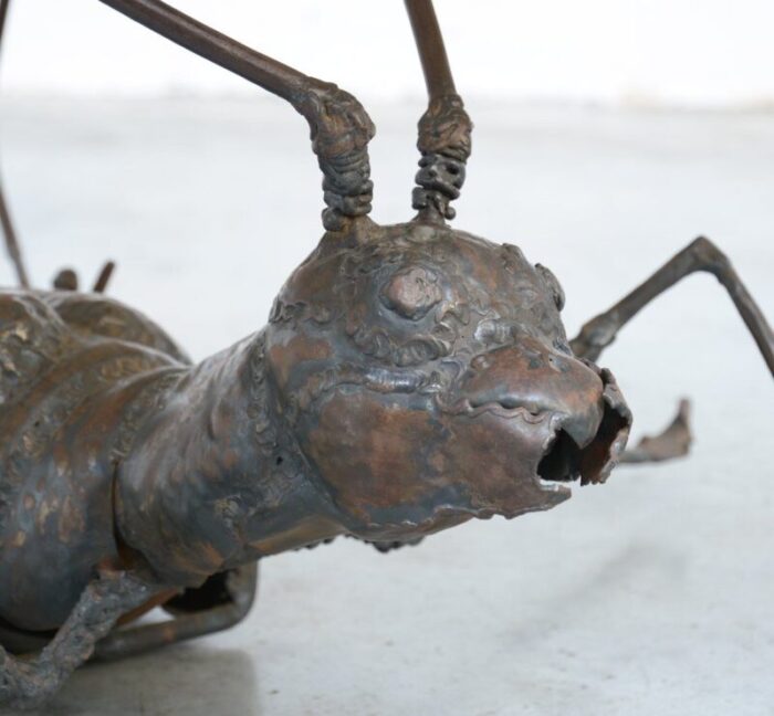 coffee table with a handcrafted metal cricket sculpture base 1970s 6