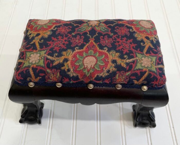 early 20th century diminutive clawfoot footrest with new upholstery 1671