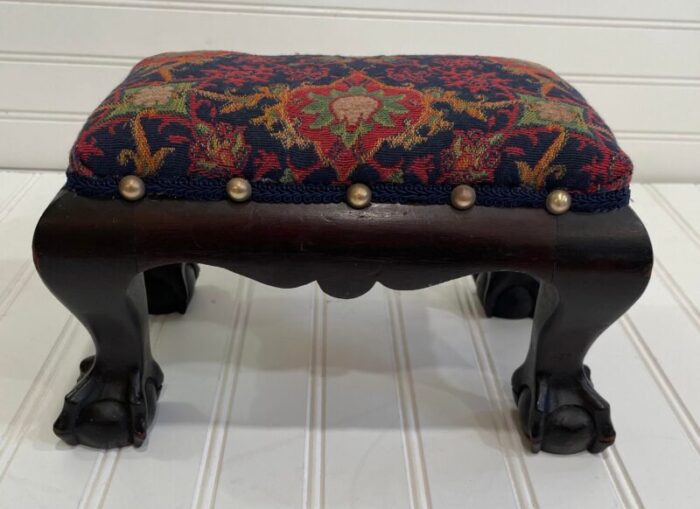 early 20th century diminutive clawfoot footrest with new upholstery 4182