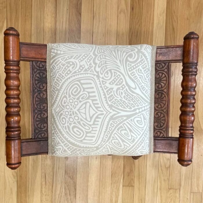 early 20th century traditional victorian spooled footstool with abstract beige upholstery 2289