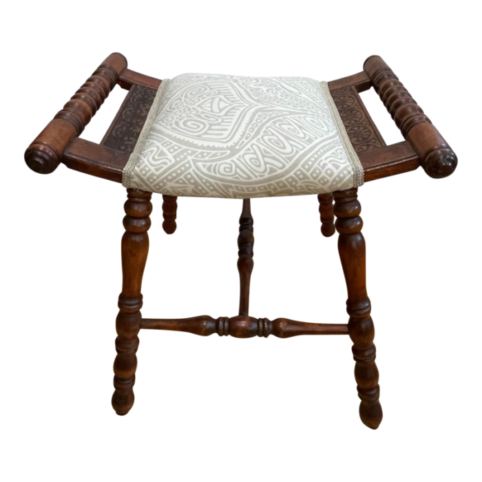 early 20th century traditional victorian spooled footstool with abstract beige upholstery 8515