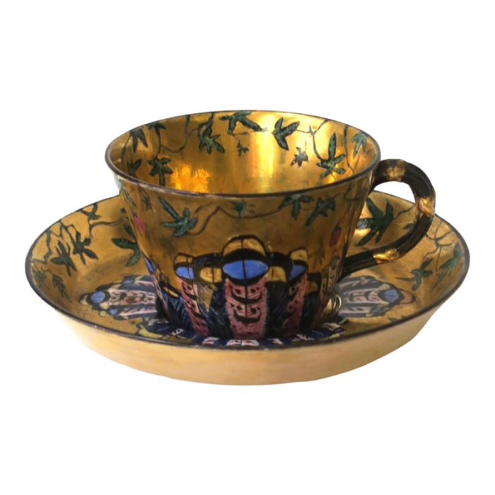 gold porcelain coffee or tea cup and saucer with butterfly design 1913