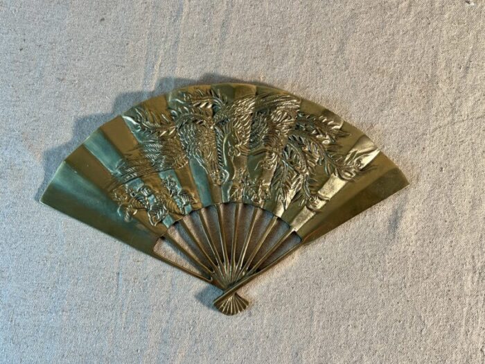 mid 20th century decorative brass wall fan with phoenix imagery 6579