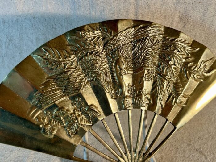 mid 20th century decorative brass wall fan with phoenix imagery 8776