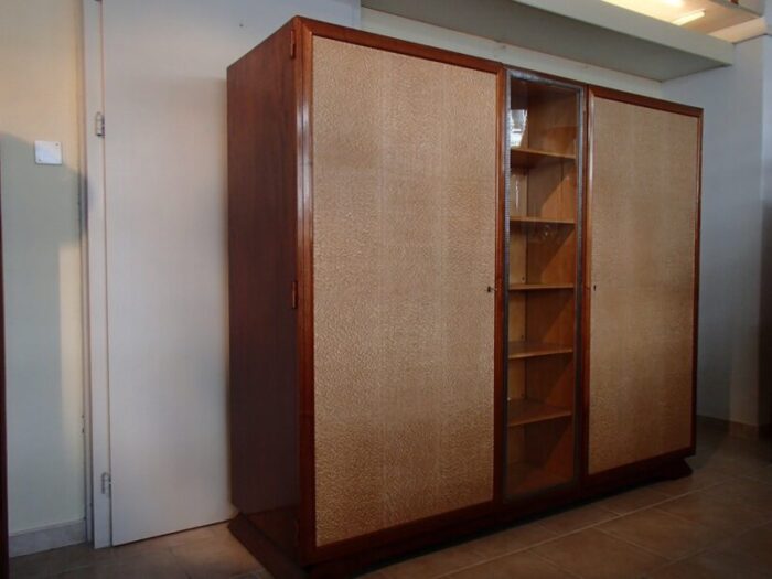 rosewood cabinet with showcase framed in wrought iron doors with raylike plastic cover 1930s 1