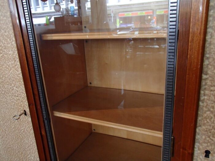 rosewood cabinet with showcase framed in wrought iron doors with raylike plastic cover 1930s 11